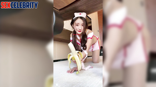 Chinese Yang Mi (中国人杨幂) as a nurse eats a banana 护士吃香蕉 [PREMIUM]